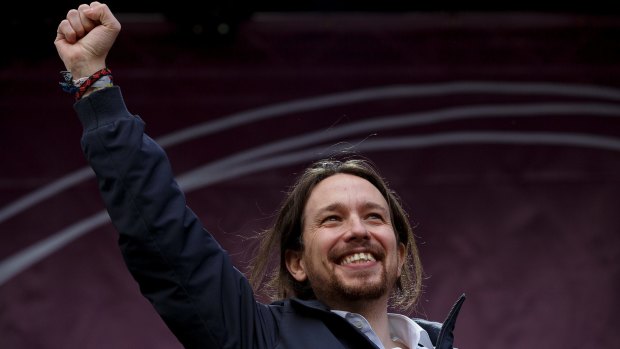 Podemos leader Pablo Iglesias salutes the crowd, put by police at 100,000.