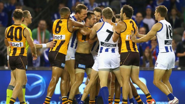 Bad guys? Hawthorn and North Melbourne players wrestle with each other after a high hit by Luke Hodge on Andrew Swallow in round five.