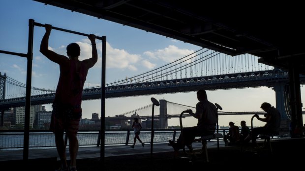 New Yorkers work out at a park along the East River, in the city's Lower East Side neighbourhood.