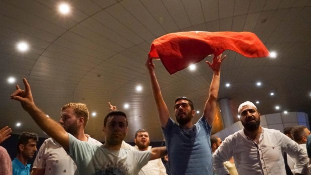 Supporters of President Erdogan chant slogans at Ataturk Airport in Istanbul on Saturday. 