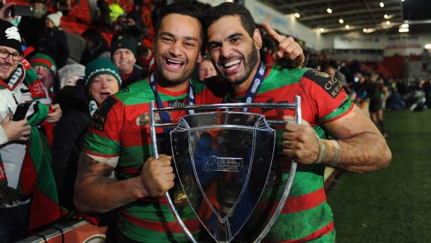 World champions: Former captain John Sutton and his successor Greg Inglis celebrate with the trophy after victory in the World Club Challenge match between St Helens and South Sydney Rabbitohs at Langtree Park.