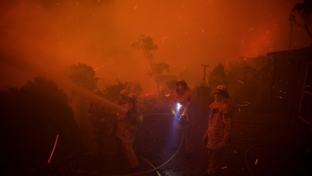 NSW Rural Fire Service crews prepare for impact on homes in Coronation Parade.