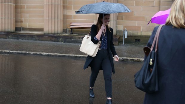 Lucy McNamara tries to evade the media after Friday's sentencing.