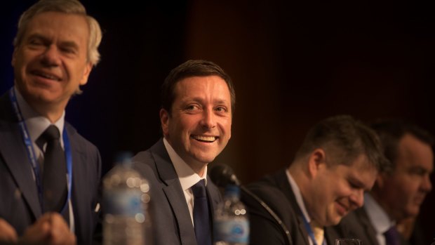 Re-elected Liberal Party president Michael Kroger (left) with Liberal Opposition Leader Matthew Guy (second from left) at the Liberal Party conference.