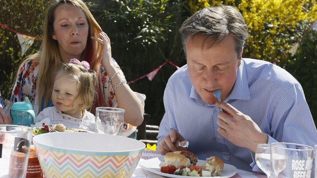 Prime Minister David Cameron has been mocked for eating a hot dog with a knife and fork as he campaigns for Britain's general election next month.