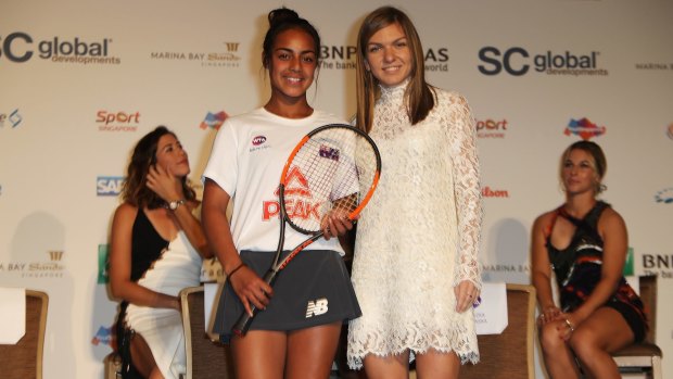 Annerly Poulos was presented with a racquet by world No.4 Simona Halep while at the tournament in Singapore.