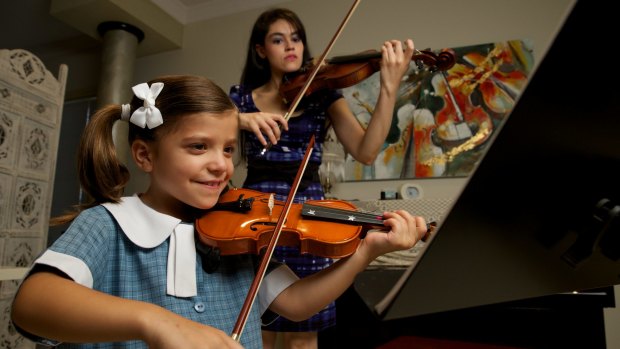 Six-year-old Natalia Zahorsky with her tutor Monica Rouvellas.