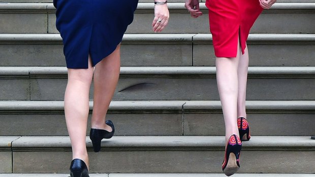 Northern Ireland first minister Arlene Foster (left) and British PM Theresa May show off stylish footwear.