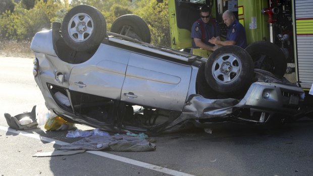 Two people were taken to hospital in a stable condition after their car rolled multiple times on the Federal Highway near Sutton.