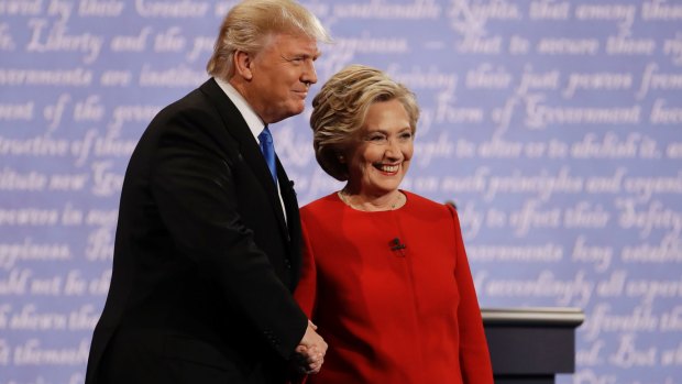 Democratic presidential nominee Hillary Clinton shakes hands with Republican presidential nominee Donald Trump during the presidential debate.