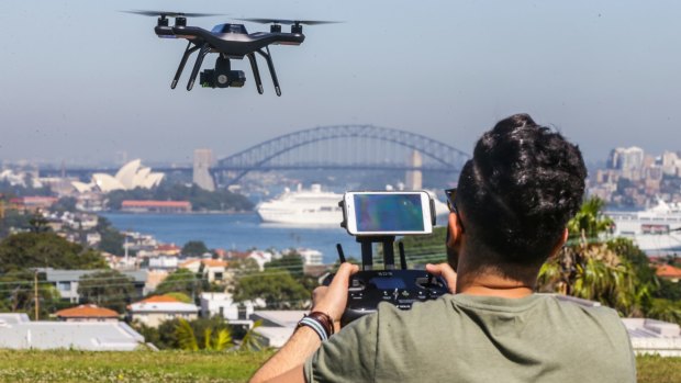 A user flies his drone at a park at Sydney's Dover Heights.