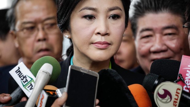 Yingluck Shinawatra speaks to the media outside the Supreme Court in August.