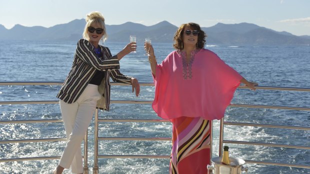 Patsy (Joanna Lumley) and Edina (Jennifer Saunders) in their element chugging champagne, in a scene from the new 20th Century Fox film.