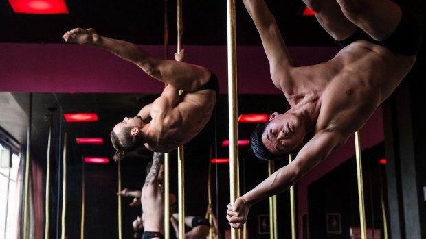 Male pole dancers preparing for competition in Sydney in 2015.