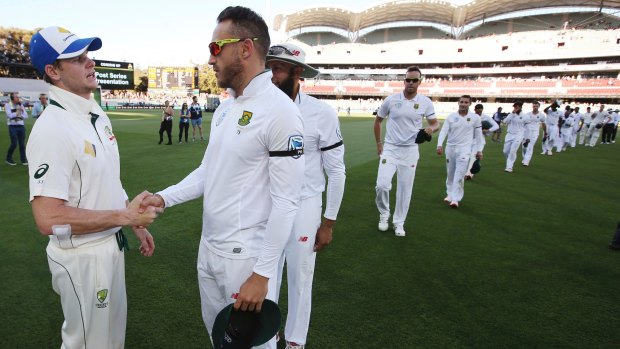 Well-earned win: Australian captain Steven Smith with South African counterpart Faf du Plessis.