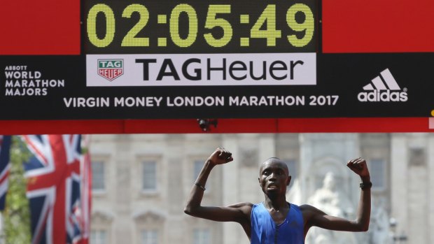 Kenya's Daniel Wanjiru crosses the finish line to win the London Marathon.