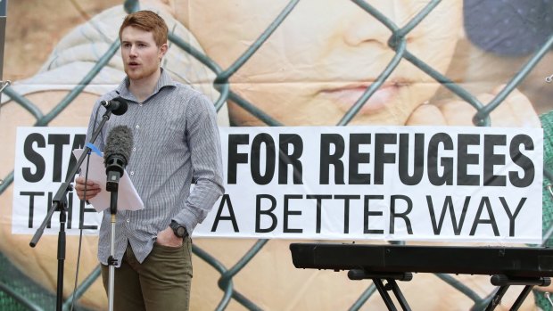 Former Save the Children worker Tobias Gunn speaks about life for detainees on Nauru at a protest last week.