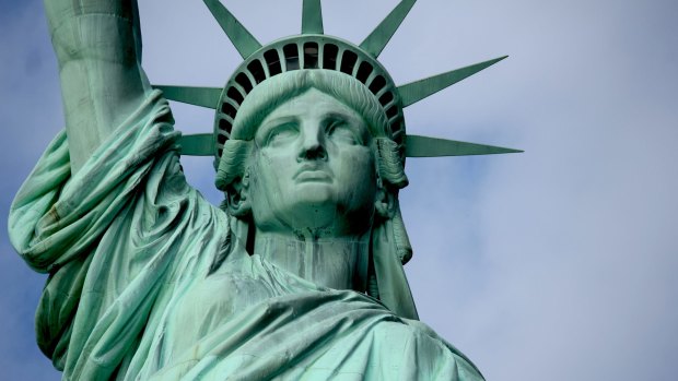 The Statue of Liberty in New York is holding something aloft. What is it?