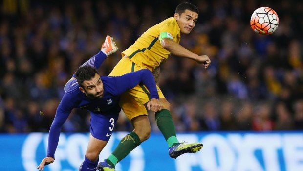 City's likely lad: Socceroo Tim Cahill gets the better of Greece's Giorgios Tzavellas during the international friendly at Etihad Stadium on June 7, 2016.