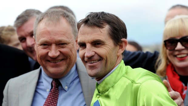 Jockey Dwayne Dunn (R) of Royal Symphony with trainer Tony McEvoy (L) after winning Race 4 the Taj Rossi Series Final on Flemington Finals Day at Flemington Race Course in Melbourne, Saturday, July 8, 2017.