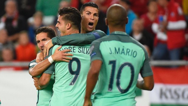 Portugal's Cristiano Ronaldo celebrates Andre Silva's goal against Hungary in group B.