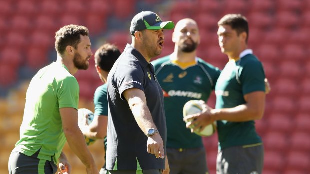Hard task master: Wallabies coach Michael Cheika barks instructions to players during the Wallabies captain's run at Suncorp Stadium on Friday.