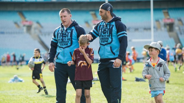 Kings of the kids: Paul Gallen and Robbie Farah at an NRL skills clinic at ANZ Stadium on Monday.