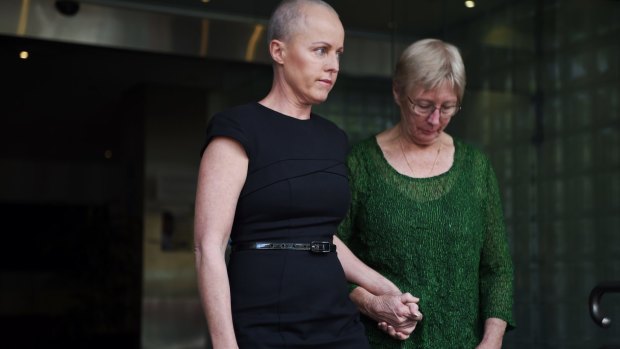 Ashley Bryant's widow Deborah, left, leaves the NSW Coroner's Court in Glebe on Wednesday.