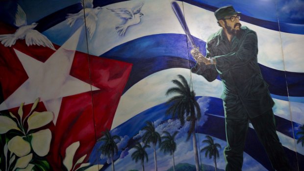 Batter up: A mural of Fidel Castro playing baseball at the Latin American baseball stadium in Havana. The restoration of diplomatic ties with the Caribbean nation could usher in a new era in US-Cuba sporting relations.