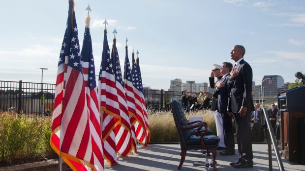 President Barack Obama with Defense Secretary Ash Carter and Chairman of the Joint Chiefs of Staff Gen. Joseph Dunford, stand as the national anthem is played during a memorial observance ceremony at the Pentagon, Sunday, Sept. 11, 2016.