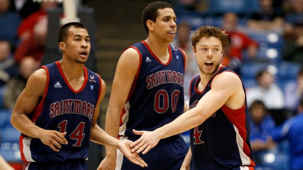 College days: Stephen Holt with St Mary's Gaels teammates Brad Waldow and Matthew Dellavedova during a game against the Middle Tennessee Blue Raiders during the first round of the 2013 NCAA tournament.