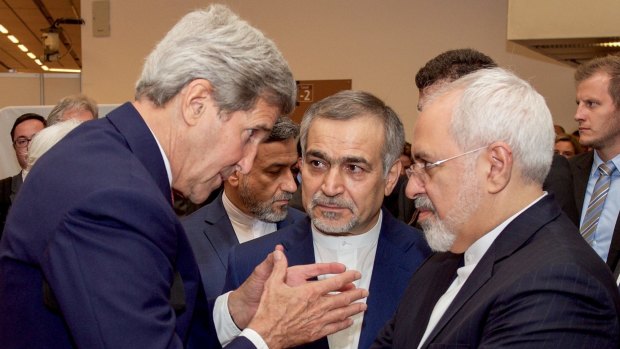 US Secretary of State John Kerry (left) speaks with Hossein Fereydoun (centre), the brother of Iranian President Hassan Rouhani, and Iranian Foreign Minister Javad Zarif (right), before announcing the deal.