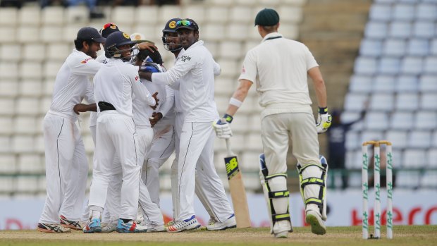 Sri Lanka celebrates the dismissal of Australia's Steve Smith on day five.