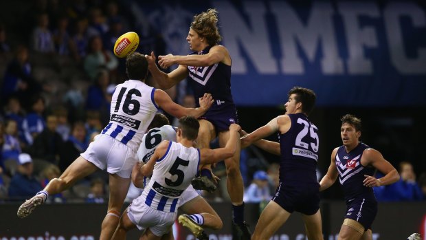 Nat Fyfe of the Dockers attempts to mark during the match against North Melbourne.