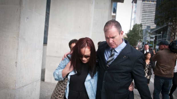 A member of Warriena Wright's family leaving court with Damien Hansen.
