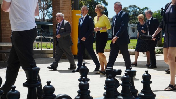 Bill Shorten and Kristina Keneally campaign in Bennelong at St Charles Catholic school in Ryde on Tuesday. 