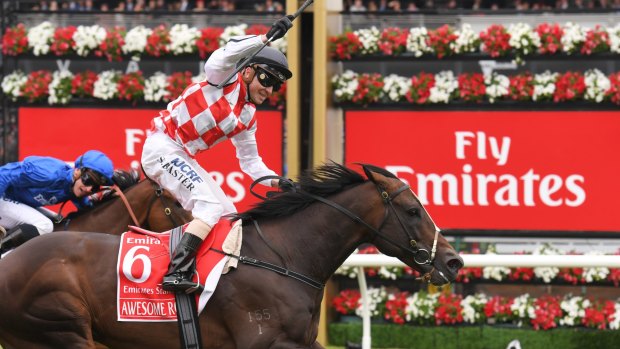 Awesome Rock wins the Emirates Stakes, and jockey Stephen Baster celebrates.