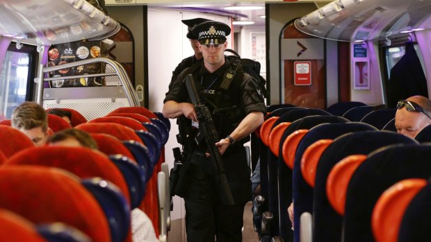 Armed police officers are patrolling on board trains across Britain for the first time.