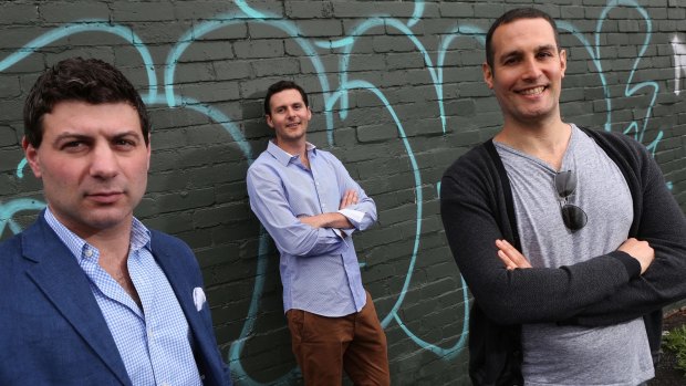 Bluethumb co-founder Ed Hartley is flanked by investors Adam Schwab, left and Jeremy Same.