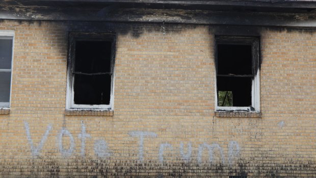 "Vote Trump" is spray painted on the side of the fire-damaged Hopewell MB Baptist Church in Greenville, Mississippi.