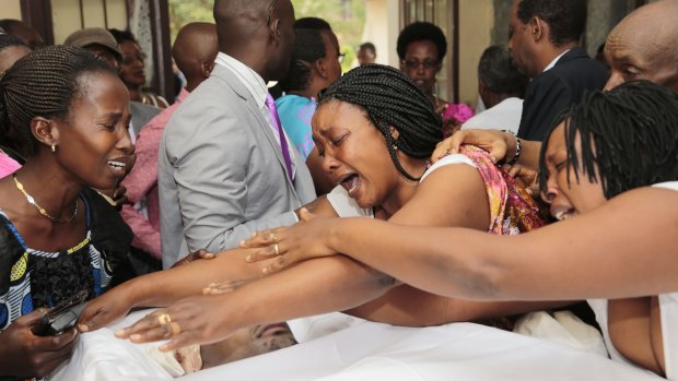 Relatives and friends grieve at the funeral of Patrick Ndikumana, who they say was killed in the police attack in Jabe neighbourhood of Bujumbura last week.