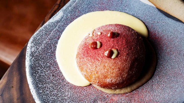 6 Head's doughnut is a sugared puffball with creme anglaise, fig sauce and strawberry powder.
