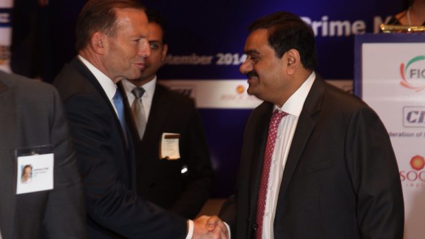 Then Prime Minister Tony Abbott with mining magnate Gautam Adani in Delhi in 2014. 