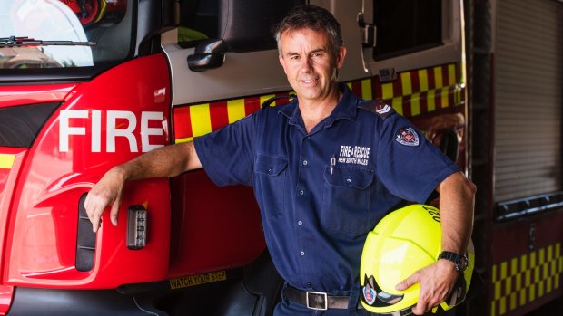 Firefighter Jayson Sharman is spending Christmas Day with his second family, the fire station crew. Photo: James Brickwood