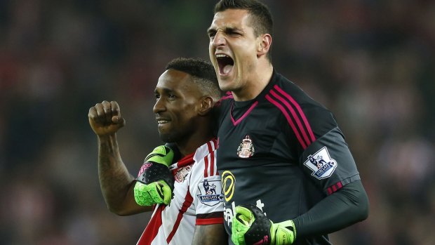 Sunderland goalkeeper Vito Mannone, right, and Jermain Defoe celebrate after the final whistle.