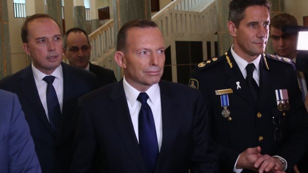 Immigration Minister Peter Dutton, Prime Minister Tony Abbott and Australian Border Force commissioner Roman Quaedvlieg.