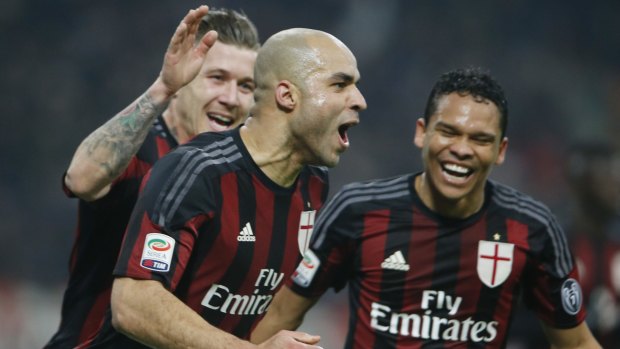 AC Milan's Alex celebrates with his teammates Juraj Kucka, left, and Carlos Bacca.
