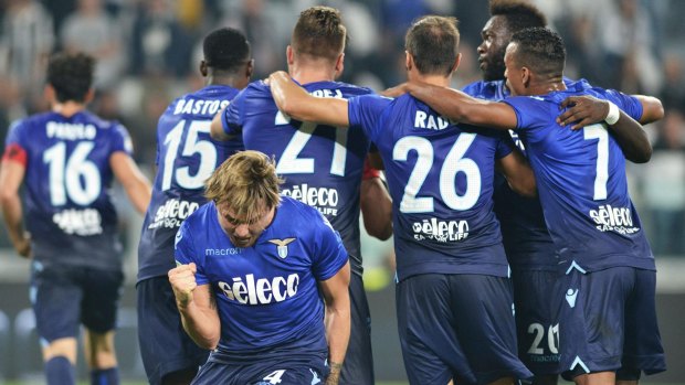 Lazio players celebrate their win over Juventus.