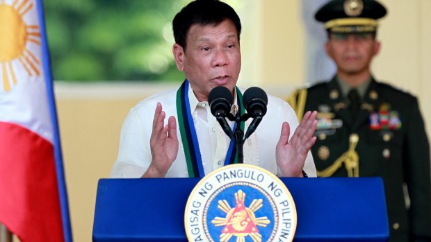 Philippines President Rodrigo Duterte addresses  troops  in Quezon City, north-east of Manila.