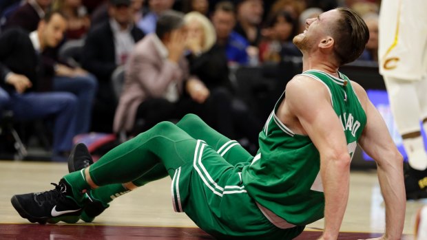 Celtics Gordon Hayward grimaces in pain after an awkward fall left him badly injured. 